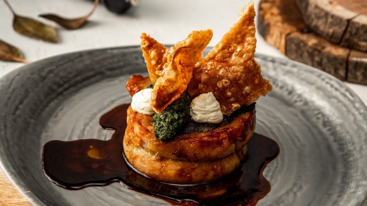 Slow-Cooked Porchetta with pork crackling, parsley pesto and smoked sour crème